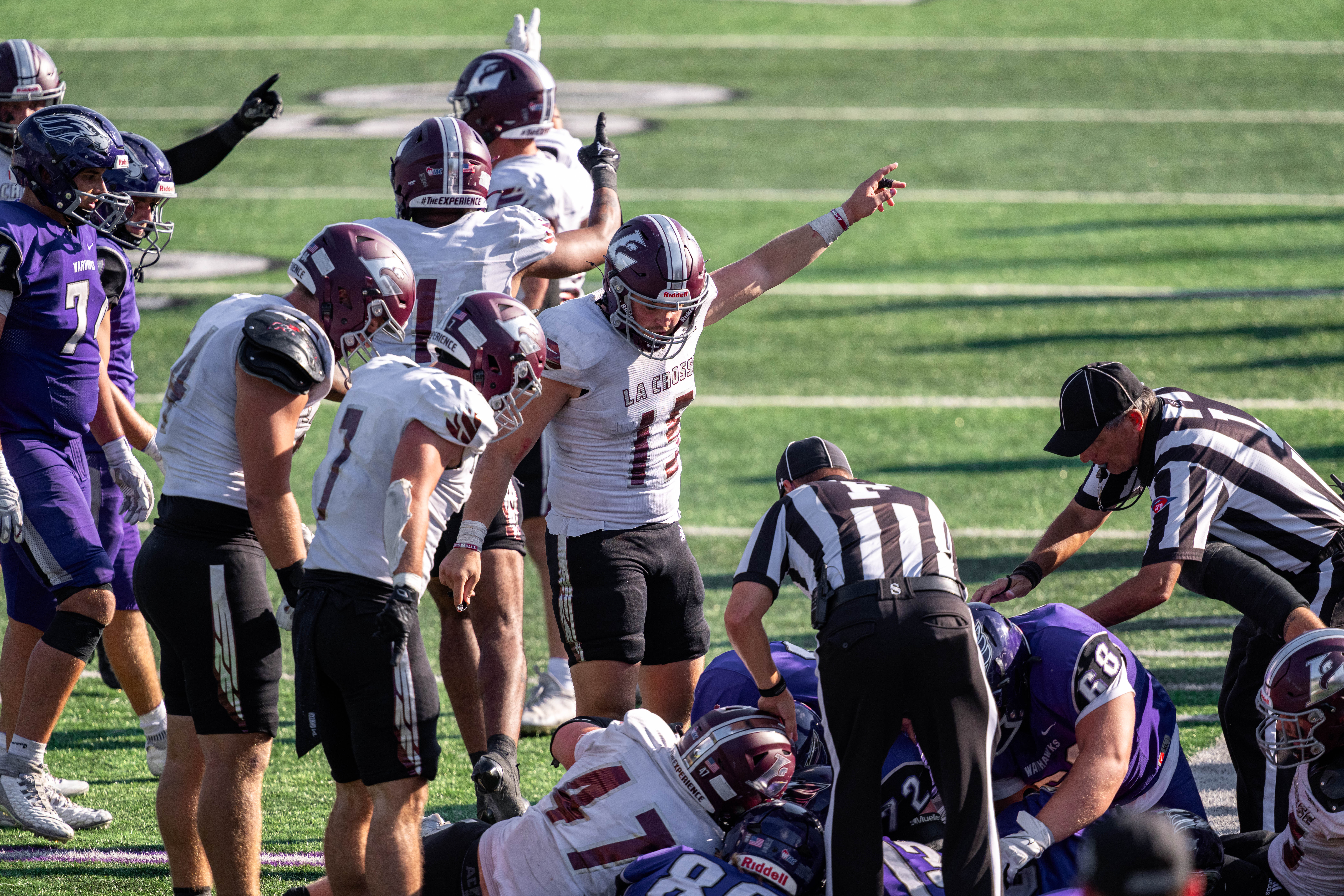 Oct 4, 2025; Whitewater, Wisconsin, USA; A fight for a fumbled ball in overtime unfolds durning a college football game between the University of Wisconsin-Whitewater Warhawks and the University of Wisconsin-La Crosse Eagles at Perkins Stadium on October 04, 2025 in Whitewater, Wisconsin. Photography by Ross Harried for Second Crop Sports.