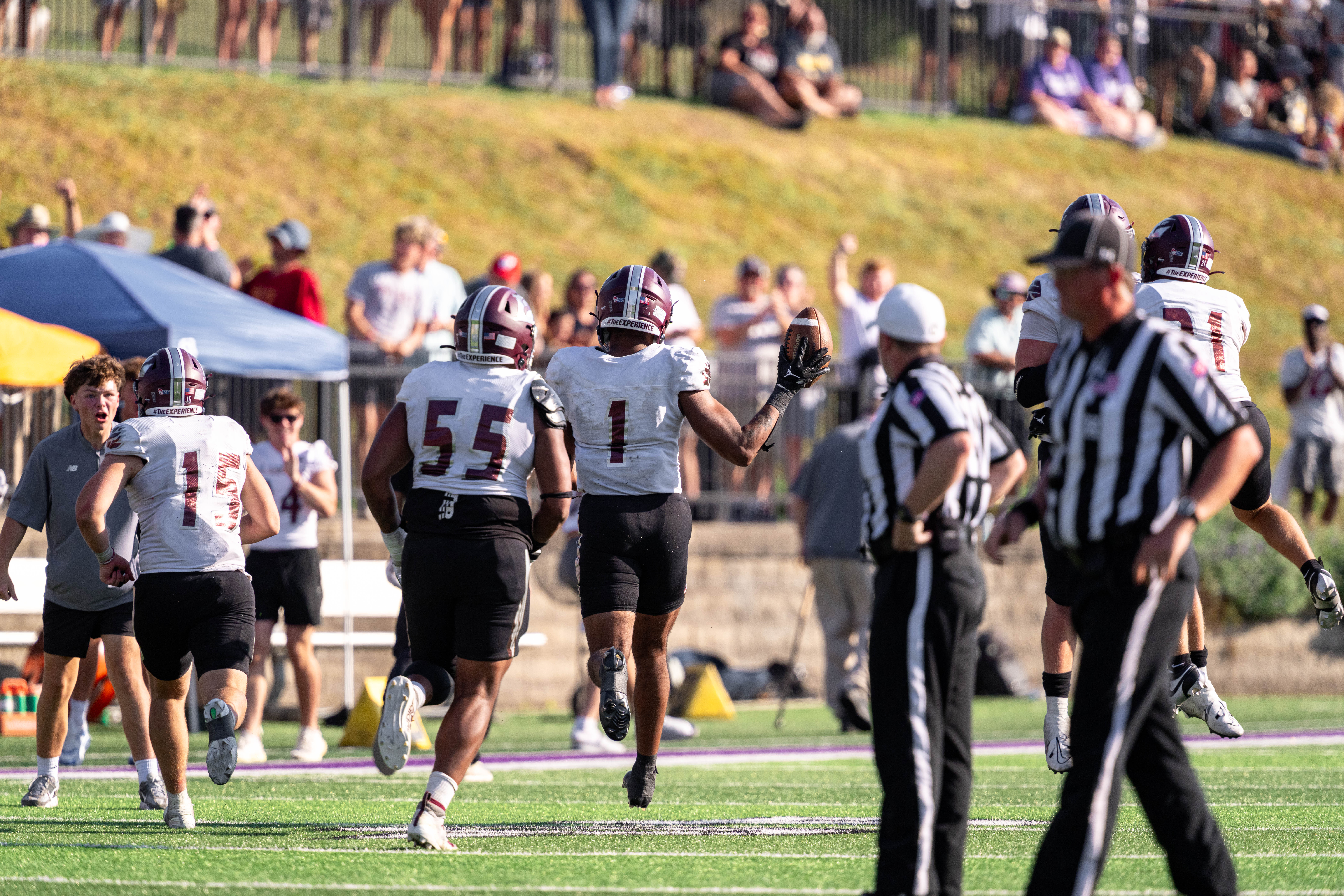 Oct 4, 2025; Whitewater, Wisconsin, USA; University of Wisconsin-La Crosse Eagles defensive lineman Christian Powell (1) runs off the field with the covered fum durning a college football game between the University of Wisconsin-Whitewater Warhawks and the University of Wisconsin-La Crosse Eagles at Perkins Stadium on October 04, 2025 in Whitewater, Wisconsin. Photography by Ross Harried for Second Crop Sports.