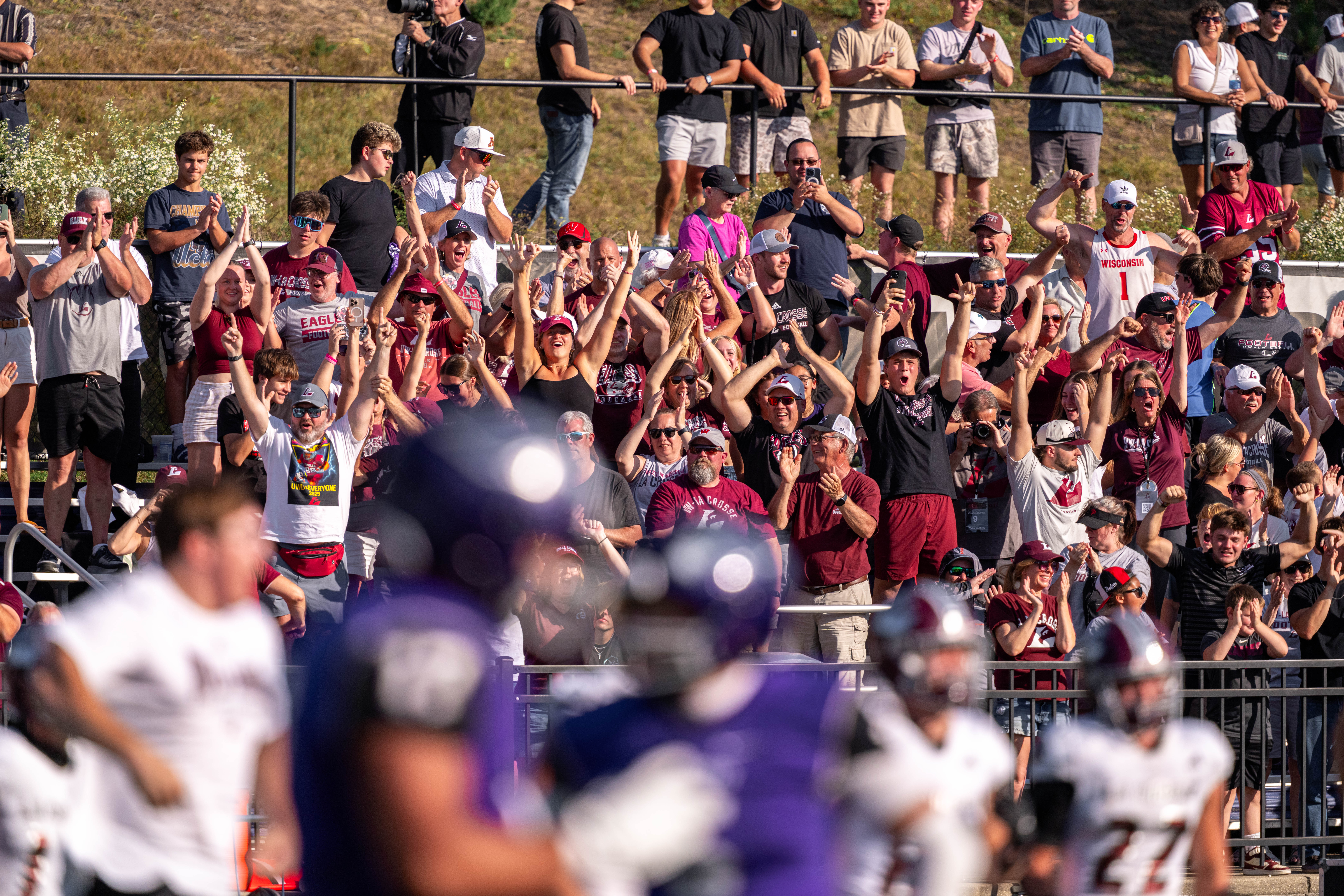 Oct 4, 2025; Whitewater, Wisconsin, USA; University of Wisconsin-La Crosse Eagle fans celebrate after a college football game between the University of Wisconsin-Whitewater Warhawks and the University of Wisconsin-La Crosse Eagles at Perkins Stadium on October 04, 2025 in Whitewater, Wisconsin. Photography by Ross Harried for Second Crop Sports.